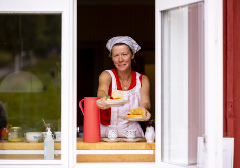 Charlotta Lennartsdotter serves waffles at Café Lillån in Södra Harads.